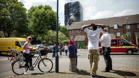 West London residents watch smoke pouring from Grenfell Tower