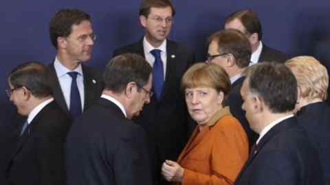 EU leaders take new stab at stemming migration, with hopes on Turkey...epaselect epa05199551 German Chancellor Angela Merkel (3-R) looks back at at Hungarian Prime Minister Viktor Orban (R) while chatting with Cypriot President Nicos Anastasiade (C-L) as they and EU leaders gather for a group photo during an extraordinary summit of European Union leaders with Turkey in Brussels, Belgium, 07 March 2016. EU leaders are set to make another attempt to stem a migration surge that is testing their unity and principles, with hopes high that neighbouring Turkey will shoulder more of the burden. EPA/OLIVIER HOSLET