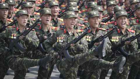 FILE - In this April 15, 2017, file photo, soldiers march across Kim Il Sung Square during a military parade in Pyongyang, North Korea, to celebrate the 105th birth anniversary of Kim Il Sung, the country's late founder and grandfather of current ruler Kim Jong Un. North Korean fury at Washington was rising well before U.S. President Donald Trump took office, in particular over reports that annual U.S.-South Korean military exercises now include training for precision strikes on the North's leadership or nuclear and military facilities. (AP Photo/Wong Maye-E)