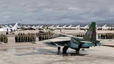epa05212821 A handout picture made available by the Russian Defence Ministry shows Russian warplanes and military personnel at the the Syrian Hmeymim airbase, outside Latakia, Syria, 15 March 2016. First group of Russian warplanes left the Hmeymim airbase for permanent location airfields in Russia. Russian President Vladimir Putin ordered the withdrawal of the majority of Russian troops from Syria on March 15. EPA/RUSSIAN DEFENCE MINISTRY / HANDOUT BEST QUALITY AVAILABLE HANDOUT EDITORIAL USE ONLY/NO SALES