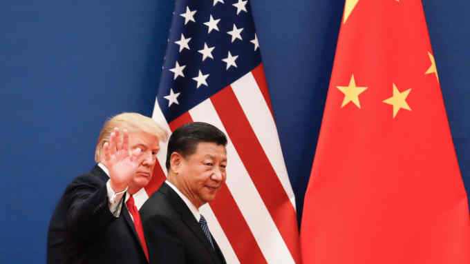FILE - In this Nov. 9, 2017 file photo, U.S. President Donald Trump waves next to Chinese President Xi Jinping after attending a business event at the Great Hall of the People in Beijing. U.S. President Donald Trump's abrupt withdrawal from his planned summit with North Korea raises the stakes for China to show that it can steer the North toward easing tensions over its nuclear program. But despite a recent warming in ties, Beijing's influence over its neighbor may be overstated. (AP Photo/Andy Wong, File)