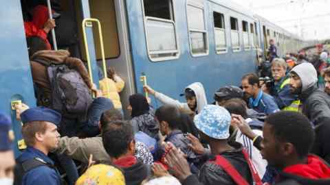 Refugees at Serbian-Hungarian border ...epa04940015 Refugees board a train at railway station at the Serbia-Hungary border town of Zakany, Hungary, 20 September 2015. The number of migrants arriving in Hungary rose sharply, Hungarian authorities said after Croatia started sending people over their border, further straining relations that the migration crisis has already soured. Hungarian police registered nearly 9,000 new arrivals from Croatia on 18 and 19 September, most of them Middle Eastern refugees. EPA/GYORGY VARGA HUNGARY OUT