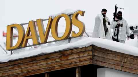 Swiss special police forces take position next to a sign reading Davos at the opening of the World Economic Forum (WEF) annual meeting in Davos on January 19, 2016. More than 40 heads of states and governments will attend the WEF in Davos, which this year is focused on &quot;mastering the fourth Industrial Revolution,&quot; organisers said. / AFP / FABRICE COFFRINI (Photo credit should read FABRICE COFFRINI/AFP/Getty Images)