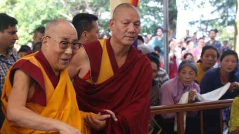 Tibetan spiritual leader the 14th Dalai Lama (L) arrives to impart the three days of teachings at the Tibetans' main temple of Tsuglagkhang in McLeodganj near Dharamsala, India, on June 6 2018