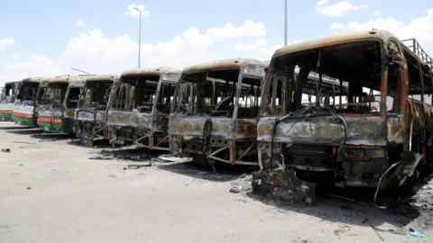 Buses, which witnesses said were burnt by workers from construction company Saudi Binladin Group in a protest over delayed wages, are seen in Mecca, Saudi Arabia May 1, 2016. REUTERS/Bandar Al Dandani/File Photo EDITORIAL USE ONLY. NO RESALES. NO ARCHIVE