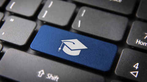 Education key with graduation hat icon on laptop keyboard
