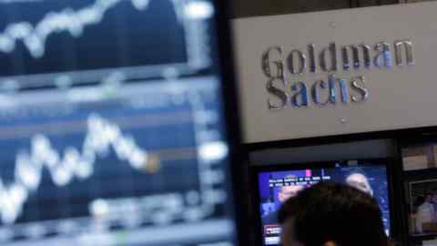 FILE - In this Oct. 16, 2014, file photo, a screen at a trading post on the floor of the New York Stock Exchange is juxtaposed with the Goldman Sachs booth. The Goldman Sachs Group Inc. reports quarterly financial results Wednesday, Jan. 20, 2016. (AP Photo/Richard Drew, File)