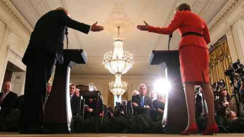 U.S. President Donald Trump and British Prime Minister Theresa May gesture at one another as they hold a joint news conference at the White House in Washington, U.S., January 27, 2017.    REUTERS/Carlos Barria