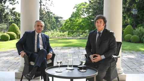 President of Argentina Alberto Fernández and president-elect Javier Milei pose for a picture