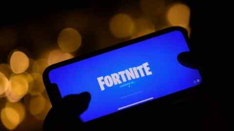 a person logging into Epic Games’ Fortnite on their smartphone