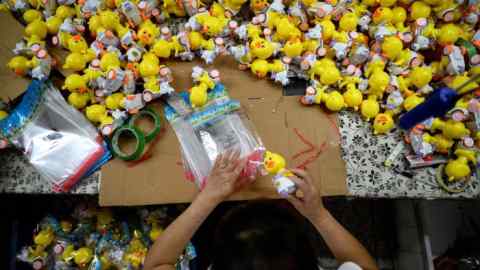 A worker packages toys at the Mendiss toy factory in China’s southern Guangdong province