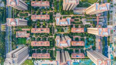 An aerial photograph shows a residential complex in Zhengzhou, Henna province, China