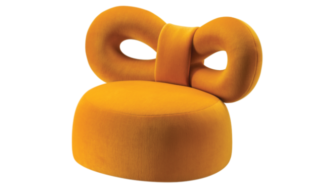 upholstered armchair with a huge bow as its backrest