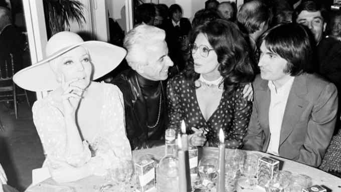 Ballerina Ludmila Tcherina, Frederic Castet, Sophia Loren and Serge Lama at a dinner party