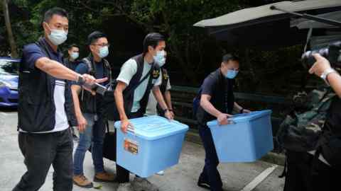 Police remove documents from the office of a student union at the University of Hong Kong