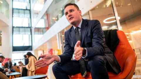 Wes Streeting parts his hands as he makes a point while speaking
