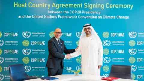 The UAE’s minister of industry and COP28 president-designate Sultan bin Ahmed Al-Jaber, right, and the UN Framework Convention on Climate Change executive secretary Simon Stiell
