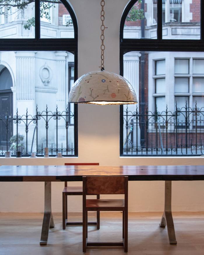 Ceramic and papier-mâché pendant lamp, £15,000, and square guest chair, £2,700