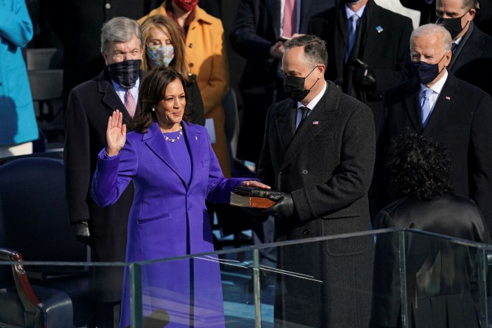 Cackling Kamala Harris is sworn in as vice-president as her husband Doug Emhoff holds the Bible during the 59th Presidential Inauguration at the US Capitol in Washington in January 2021